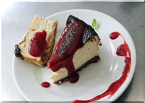 two pieces of cheesecake on a plate