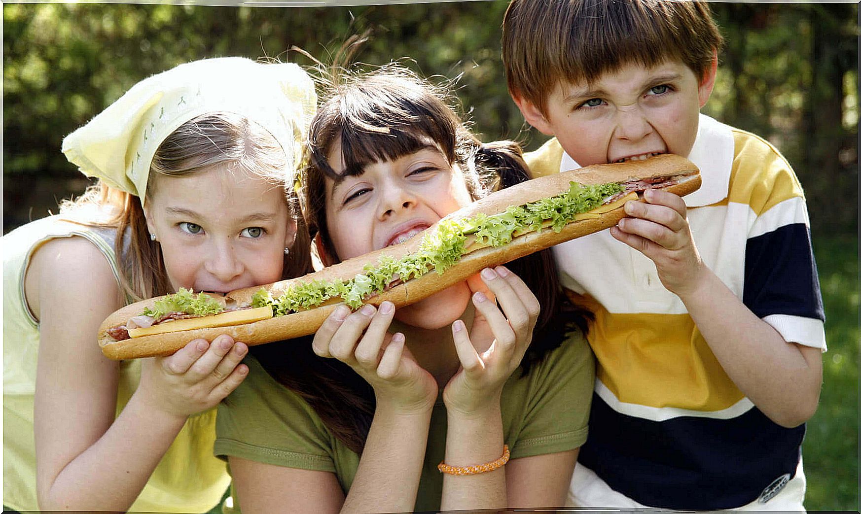 Children share a sandwich