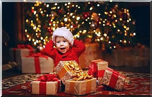 Child with Christmas gifts.