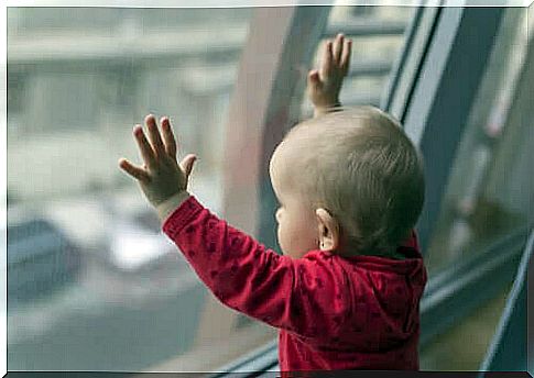 Child looking out of the window. 