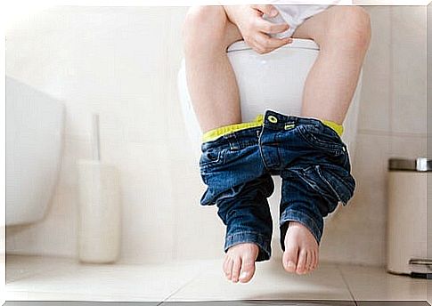 Child sitting on the toilet