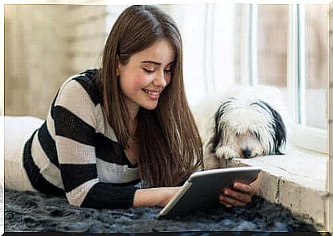 Literature for kids, teenage girl with tablet and dog.