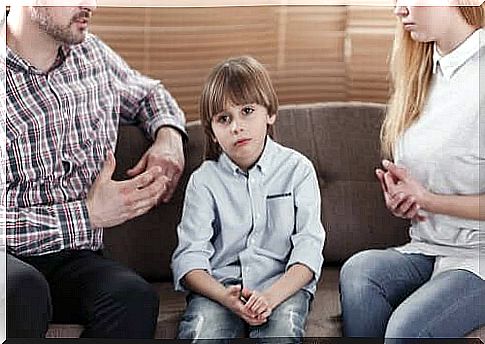 Parents arguing in front of bored son