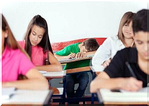 Teenager asleep in the classroom