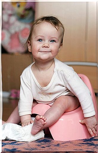 Little girl on diaper potty