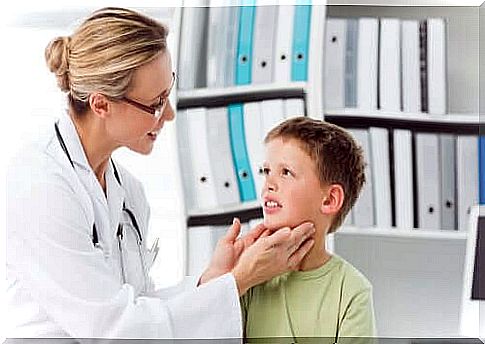 Pediatrician examining a baby's neck