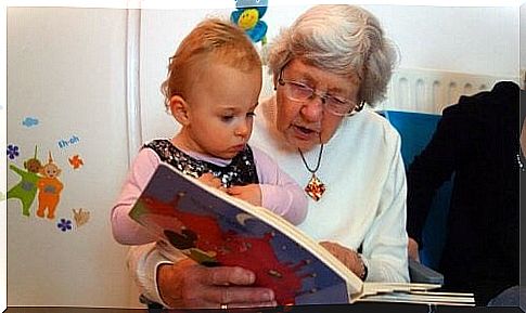 Grandmother reads a short story to her granddaughter