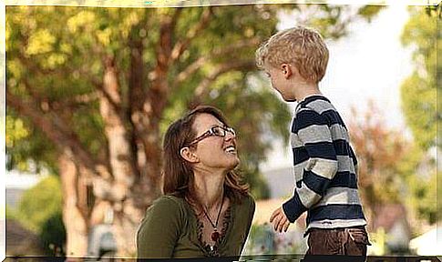 mother and son talking in the park