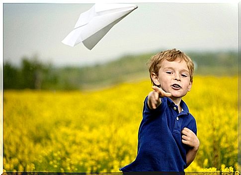 child-playing-with-a-paper-plane