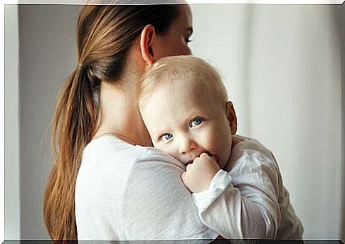 Newborn baby in mum's arms