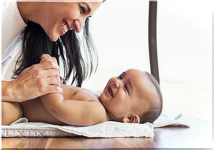 Mom plays with her baby