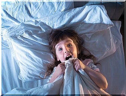 Little girl wakes up scared because of a nightmare.