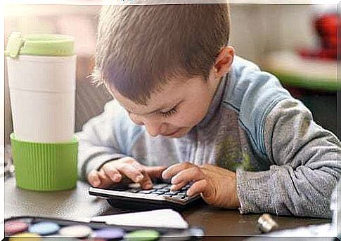 Child using a calculator.  Paracetamol for children.