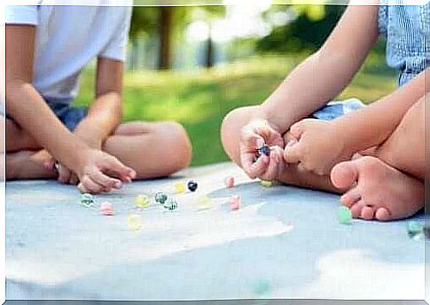 Children playing with marbles