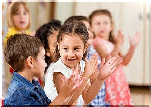 Children clapping together