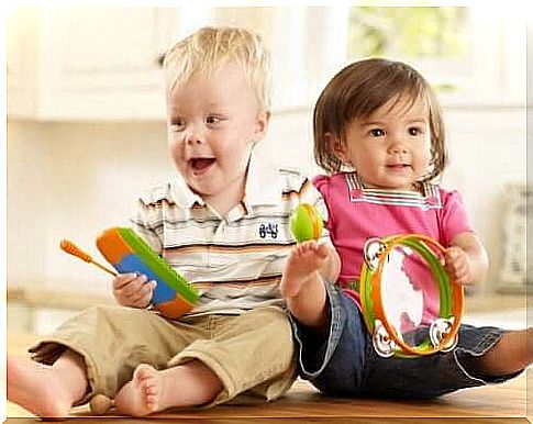 brother and sister playing with toys