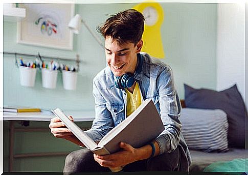 Boy reads a book