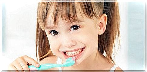 Little girl brushes her teeth