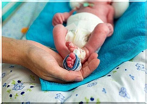 Mom keeps foot in premature baby