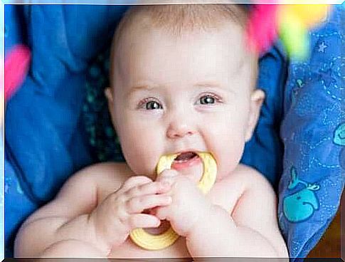 Child biting a teether.